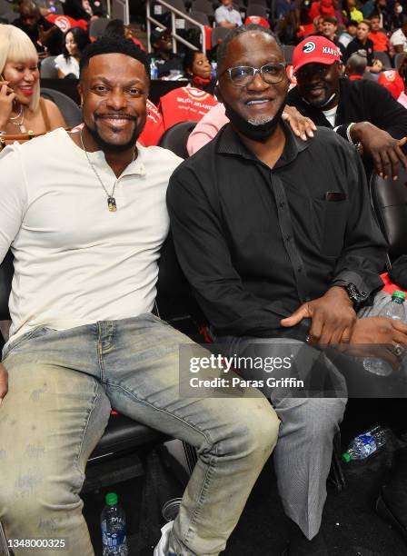 Chris Tucker and Dominique Wilkins attend Atlanta Hawks vs Dallas Mavericks home opener game at State Farm Arena on October 21, 2021 in Atlanta,...