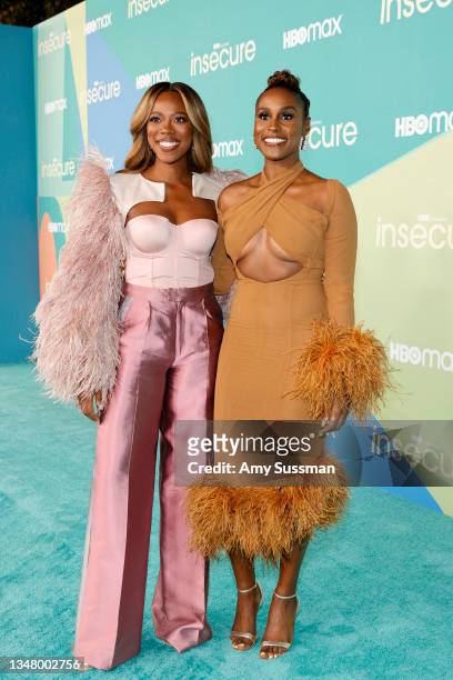 Yvonne Orji and Issa Rae attend HBO's final season premiere of "Insecure" at Kenneth Hahn Park on October 21, 2021 in Los Angeles, California.