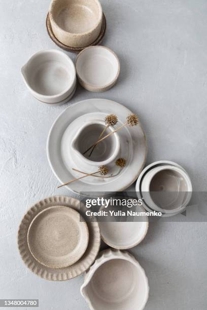 set of ceramic tableware. empty craft ceramic plates, bowls, and cups. - porslin bildbanksfoton och bilder
