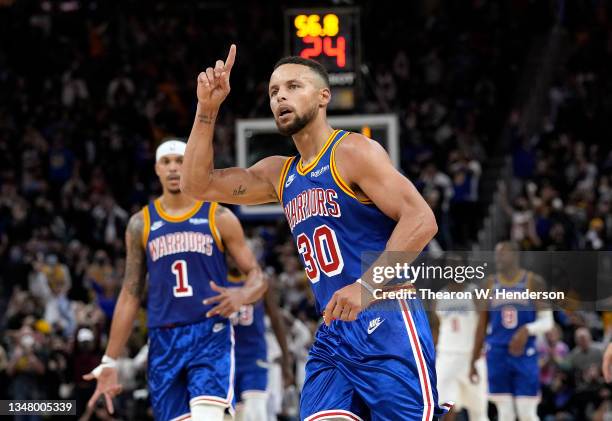 Stephen Curry of the Golden State Warriors celebrates after he made a three-point basket against the LA Clippers late in the fourth quarter at Chase...