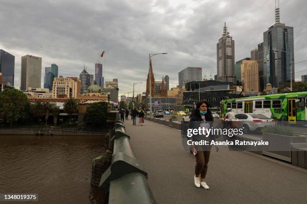 People and car traffic is seen along St Kilda Road looking towards the CBD on October 22, 2021 in Melbourne, Australia. Lockdown restrictions have...