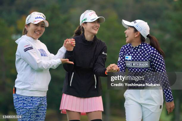 Ha-neul Kim of South Korea poses with Mika Miyazato and Ritsuko Ryu of Japan after holing out on the 18th green during the second round of the Nobuta...