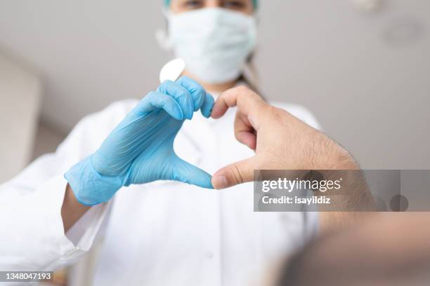 heart shape with doctor - heart surgery stock pictures, royalty-free photos & images
