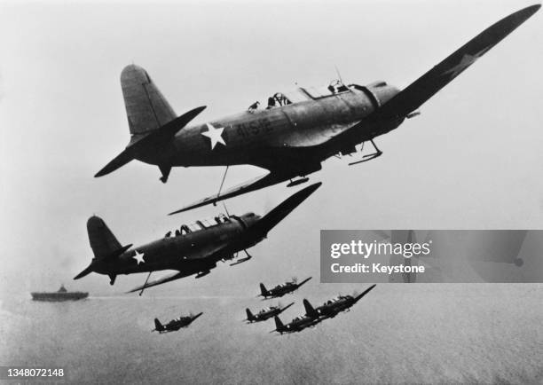 United States Navy Vought SB2U Vindicator carrier-based dive bombers of Scouting Squadron VS-41 flying in formation as they prepare to land on the...
