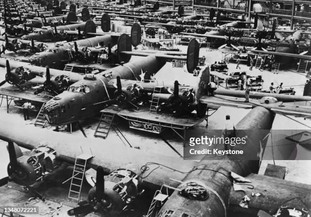 The fuselage and wing components for the Consolidated B-24 Liberator four-engined heavy bomber being assembled for service with United States Army...