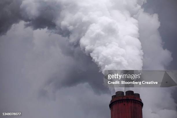 vapour rises from a chimney stack - poland european union stock pictures, royalty-free photos & images