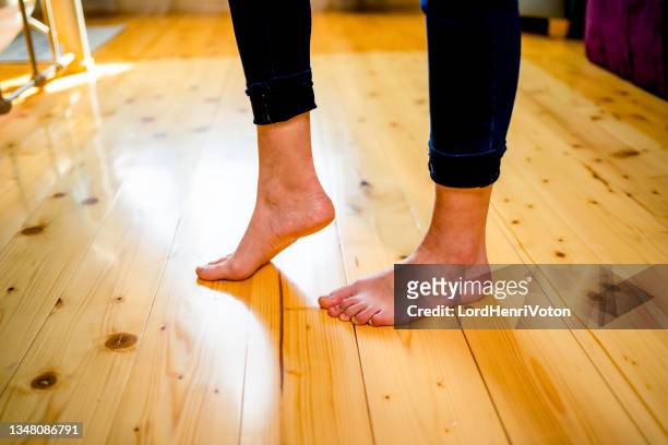 bare feet on the parquet - hot legs stock pictures, royalty-free photos & images