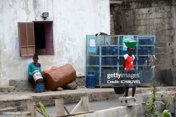cape verde women in a village - black cinder block wall stock pictures, royalty-free photos & images