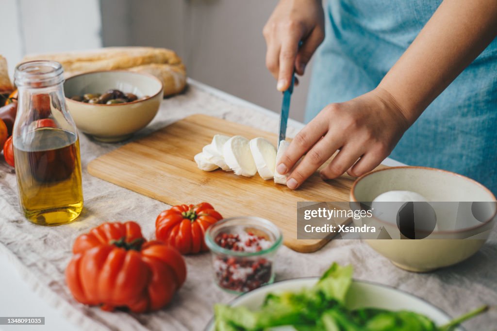 Woman cooking Caprese salad