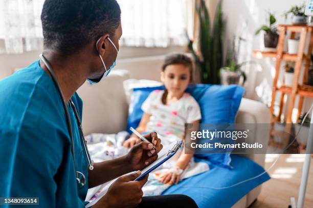 health visitor and child during home visit - paralysis stock pictures, royalty-free photos & images