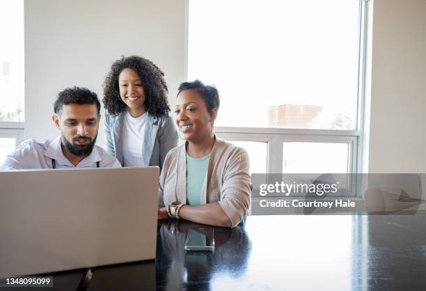 group of diverse colleagues discuss patient diagnosis during meeting in hospital board room - group women support doctor stock pictures, royalty-free photos & images