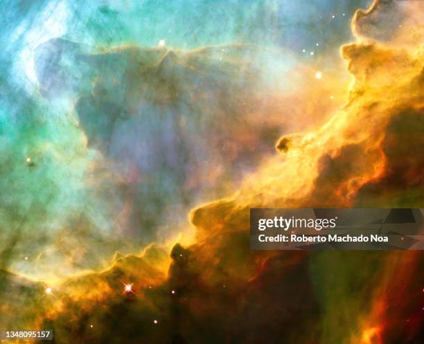 detail of the omega nebula in space - nebula stock pictures, royalty-free photos & images