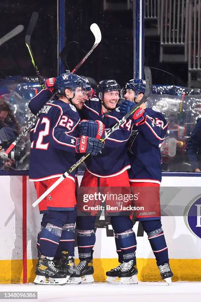 Cole Sillinger of the Columbus Blue Jackets celebrates his first career NHL goal with his teammates during a game against the New York Islanders at...