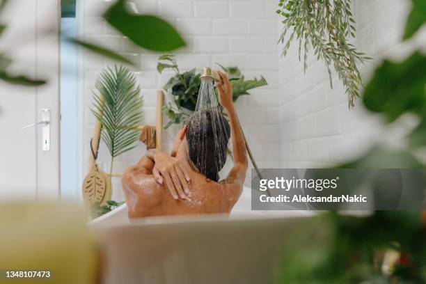 relaxing bath - bathroom exercise stock pictures, royalty-free photos & images