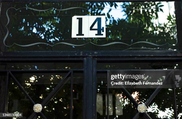 number 14 at the entrance of a building - house number stock pictures, royalty-free photos & images