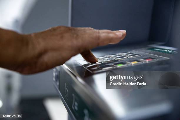 typing password into an atm - entering pin stock pictures, royalty-free photos & images