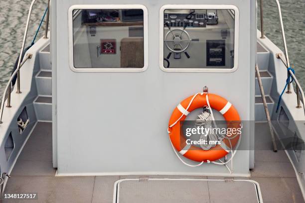 lifebuoy on boat - rettungsring stock-fotos und bilder
