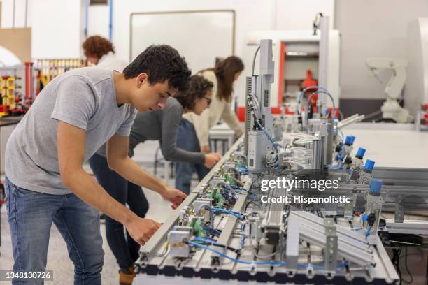 engineering students in a robotics class at college - engineering student stock pictures, royalty-free photos & images