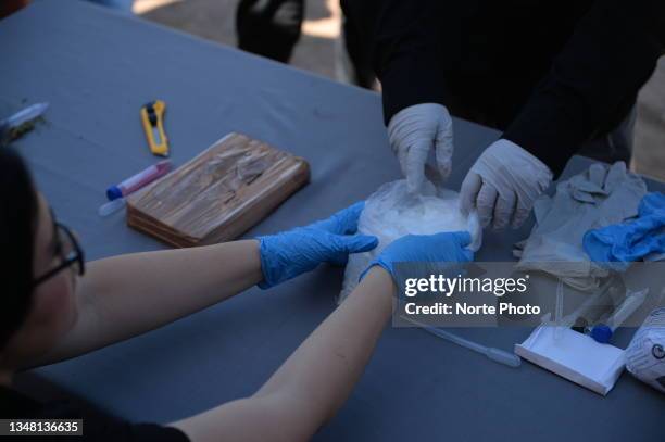 Persons carry out chemical tests on subtances to verify it is methamphetamine on October 21, 2021 in Hermosillo, Mexico. The General Prosecutor of...