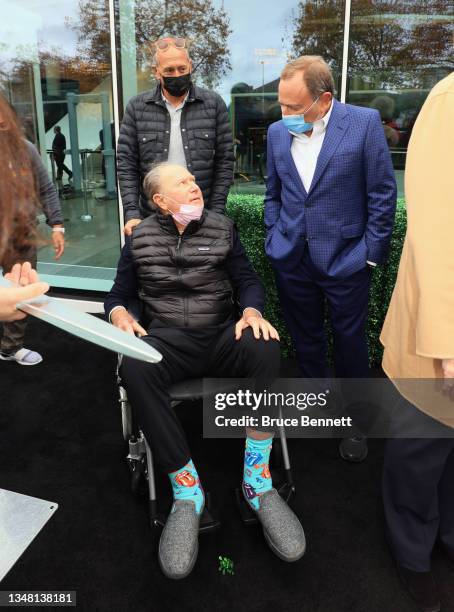 David Bonderman the owner of the Seattle Kraken and NHL Commissioner Gary Bettman chat following the cutting of the ceremonial ribbon prior to...