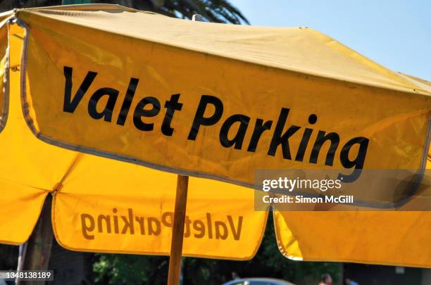umbrella valet parking stand - valet parking restaurant stock pictures, royalty-free photos & images