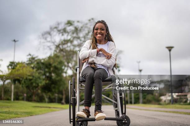 portrait of a woman in a wheelchair. - persons with disabilities stock pictures, royalty-free photos & images