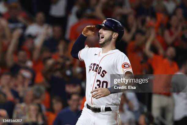 Kyle Tucker of the Houston Astros celebrates after hitting a three-run home run off Adam Ottavino of the Boston Red Sox during the eighth inning in...