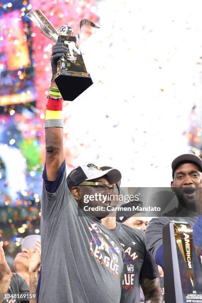 Manager Dusty Baker of the Houston Astros raises the William Harridge Trophy after defeating the Boston Red Sox 5-0 in Game Six of the American...