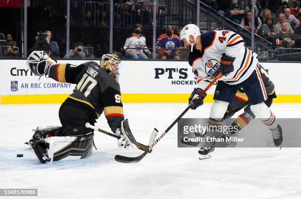 Zack Kassian of the Edmonton Oilers scores a goal against Robin Lehner of the Vegas Golden Knights in the third period of their game at T-Mobile...