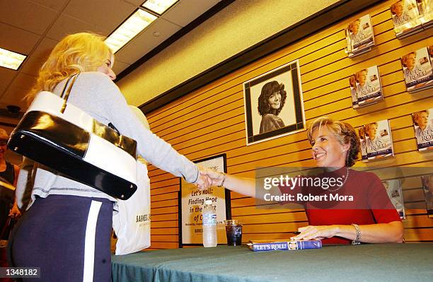Widow Lisa Beamer greats a fan prior to signing copies of her new book "Let's Roll: Finding hope in the midst of crisis" at Barnes & Noble, Westside...