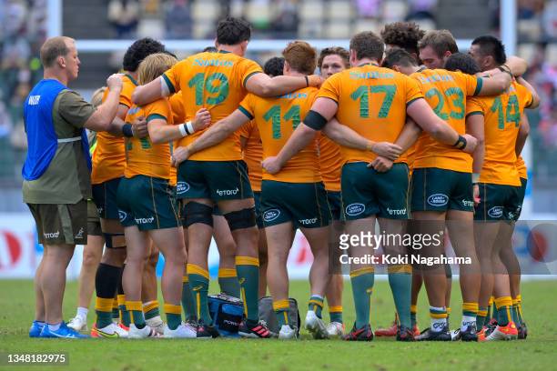 The Wallabies huddle after winning the rugby international test between Japan and Australia at Showa Denko Dome on October 23, 2021 in Oita, Japan.
