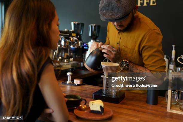 barista making coffee drip serve client on counter bar cafe, beverage served - barista coffee restaurant stock pictures, royalty-free photos & images