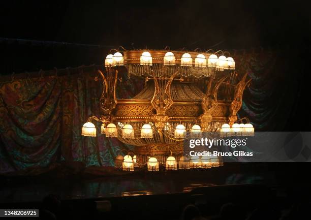 The iconic chandelier rises again during the re-opening night performance of "Phantom Of The Opera" on Broadway at The Majestic Theatre on October...