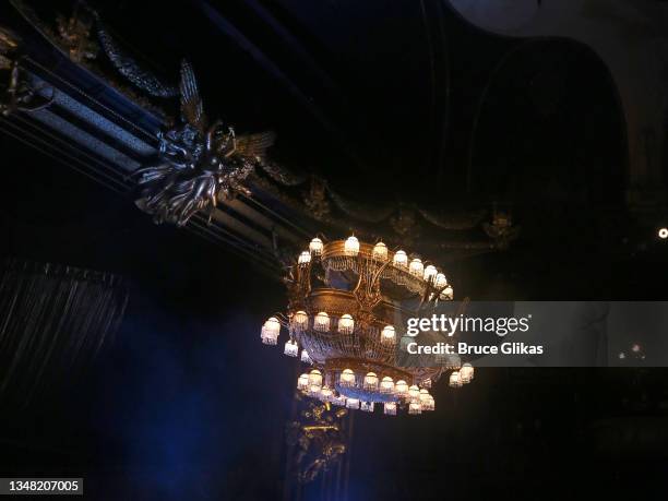 The iconic chandelier rises again during the re-opening night performance of "Phantom Of The Opera" on Broadway at The Majestic Theatre on October...