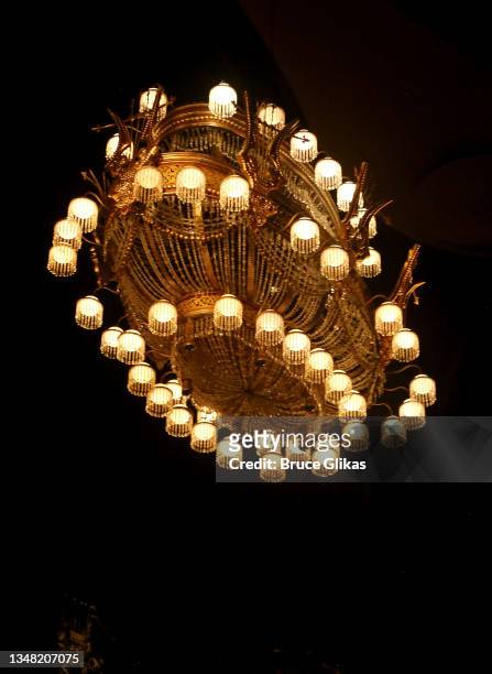 The iconic chandelier rises again during the re-opening night performance of "Phantom Of The Opera" on Broadway at The Majestic Theatre on October...