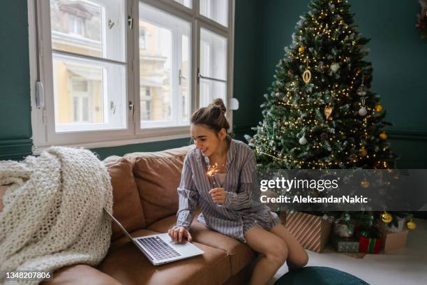 having a virtual christmas celebration with my family - christmas zoom stock pictures, royalty-free photos & images