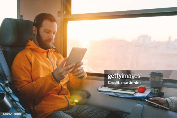 man travelling in europe with train - science and technology ebook stock pictures, royalty-free photos & images
