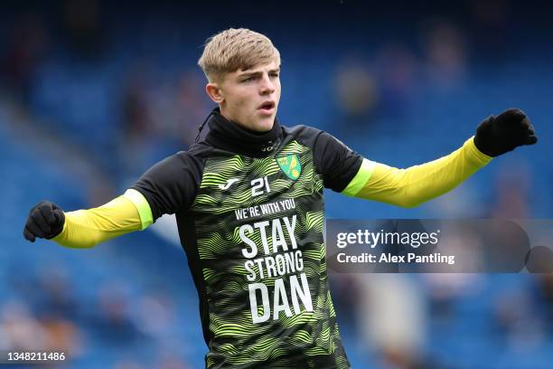 Brandon Williams of Norwich City warms up wearing a t-shirt of support for teammate Daniel Barden who has recently been diagnosed with testicular...