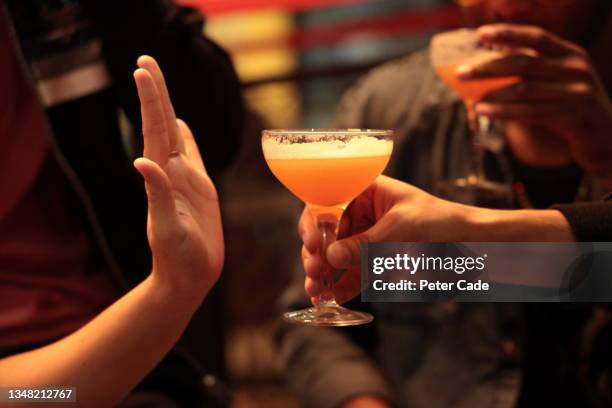 woman refusing drink - drinks stock pictures, royalty-free photos & images