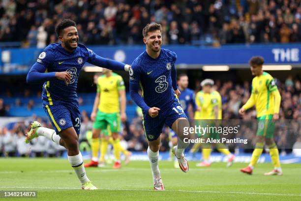 Mason Mount of Chelsea celebrates with teammate Reece James after scoring their side's first goal during the Premier League match between Chelsea and...