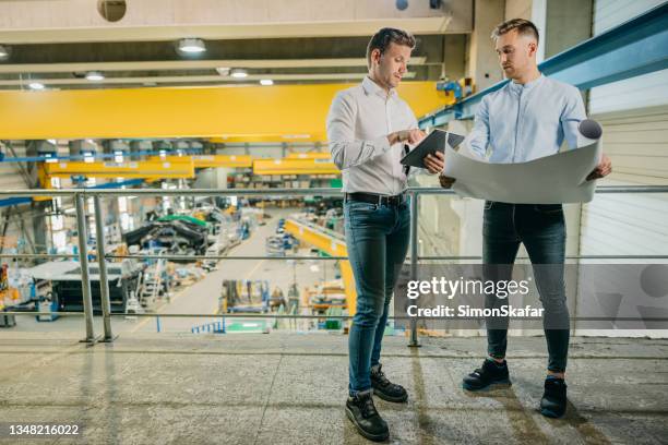 two engineers discussing and planning at factory - digital catwalk stock pictures, royalty-free photos & images