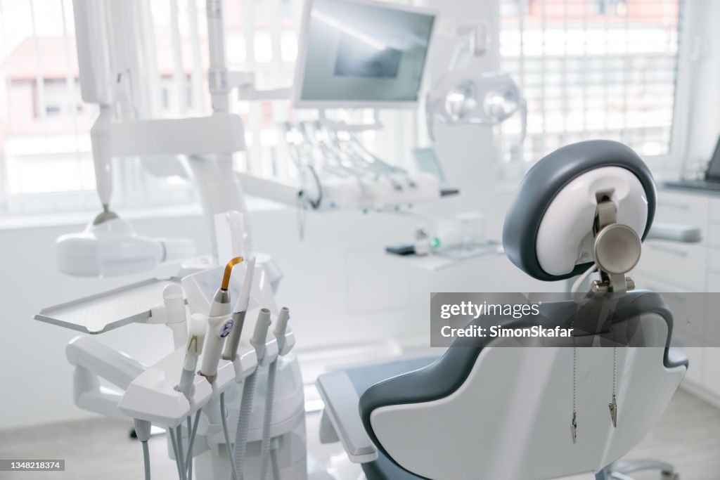 Modern dental drills and empty chair in the dentist's office