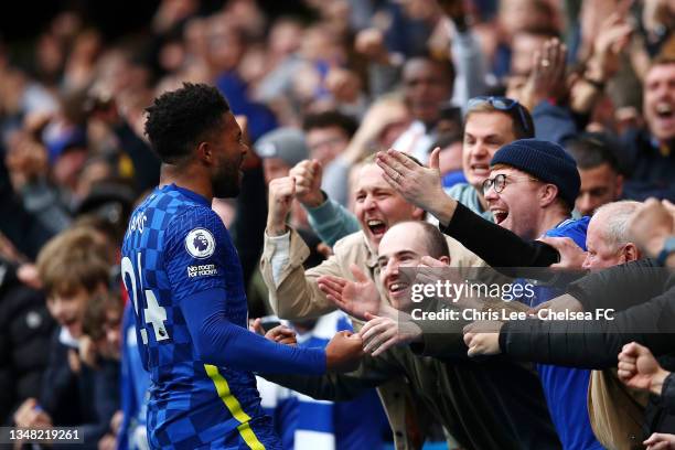 Reece James of Chelsea celebrates with the fans after scoring their side's third goal during the Premier League match between Chelsea and Norwich...