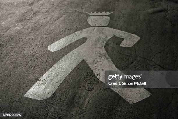 pedestrian crossing figure of a crowned male painted on the road in polanco, mexico city, mexico - imperial city stock pictures, royalty-free photos & images