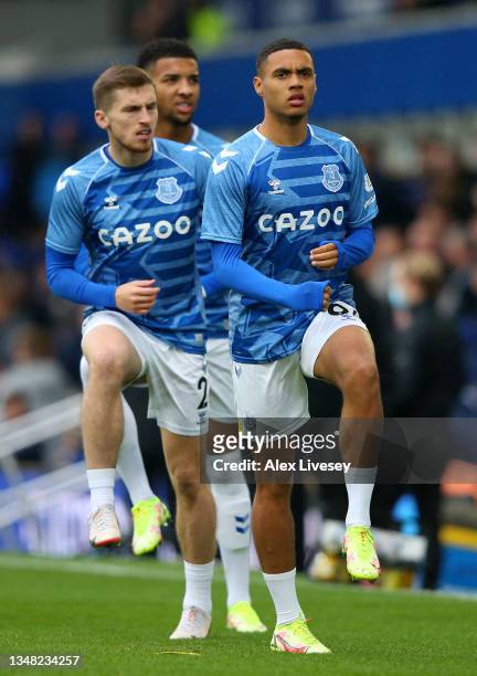 Lewis Dobbin of Everton warms up with teammate Jonjoe Kenny prior to the Premier League match between Everton and Watford at Goodison Park on October...