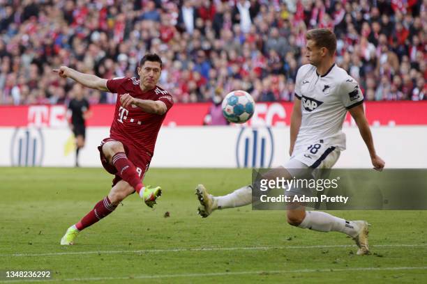Robert Lewandowski of FC Bayern Muenchen scores their team's second goal during the Bundesliga match between FC Bayern München and TSG Hoffenheim at...