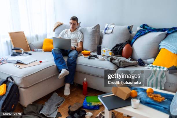 i love checking out new music - messy living room stock pictures, royalty-free photos & images