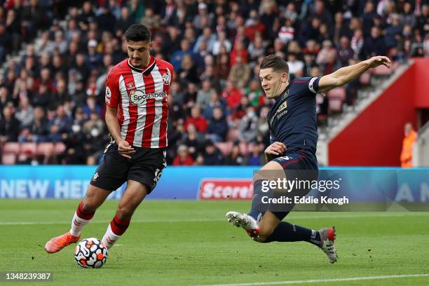 Armando Broja of Southampton is challenged by James Tarkowski of Burnley during the Premier League match between Southampton and Burnley at St Mary's...