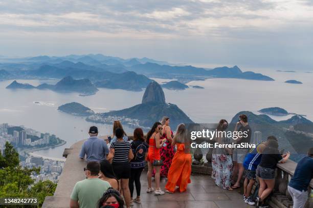 tourists in rio de janeiro - cristo redentor stock pictures, royalty-free photos & images