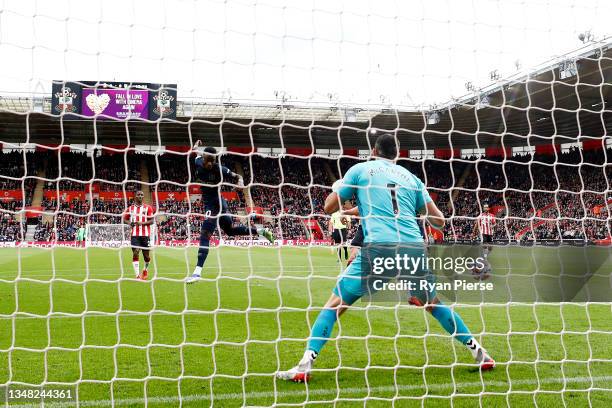 Maxwel Cornet of Burnley scores their side's first goal past Alex McCarthy of Southampton during the Premier League match between Southampton and...